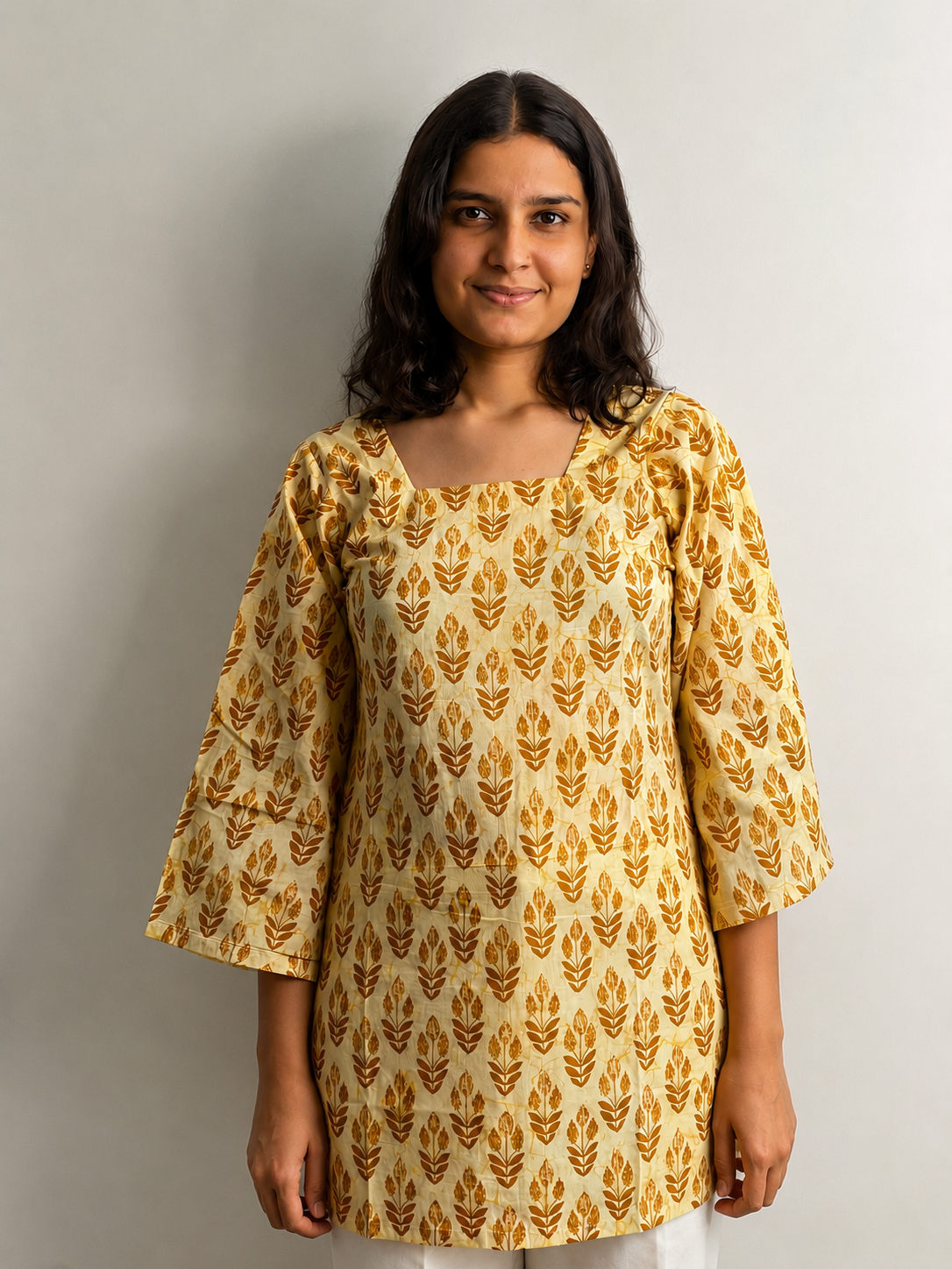 Golden-Glow-1 Golden Glow – Yellow Printed Cotton Short Kurti with Bell Sleeves - Image 1